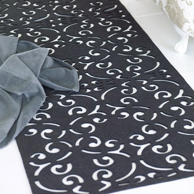 Wool rug with laser-cut pattern
